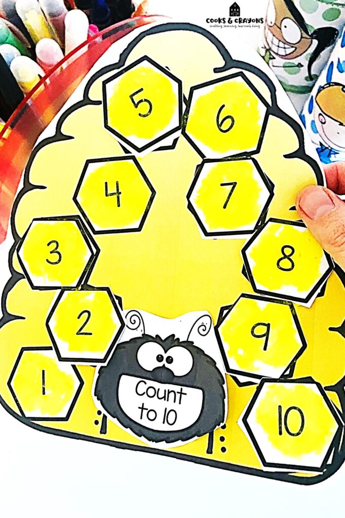 Help kids write the number before with our number sequencing activity. Download the free printable beehive template for a cut and paste math worksheet that makes learning fun. Ideal for kindergarten math activities and enhancing early math skills!